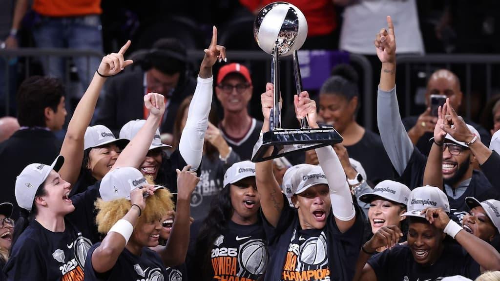 WNBA Finals Betting Guide cover (Las Vegas Aces celebrating the 2025 WNBA Finals)